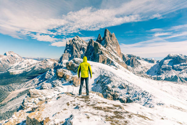 istock Man standing at top of snowy mountain 1126705989