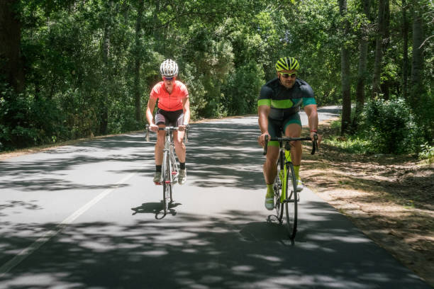 istock Determined male and female cyclists riding bicycle 1126706911