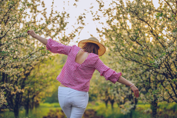 istock Brunette lady enjoying in orchard 1126706958