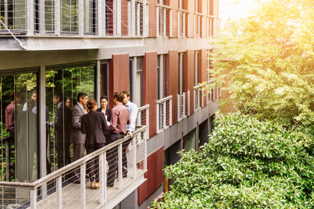 Business people discussing on balcony