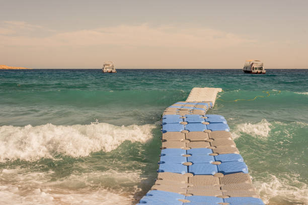 istock The waves are moving a Floating bridge on a beach in Sharm el Sheik 1126710083