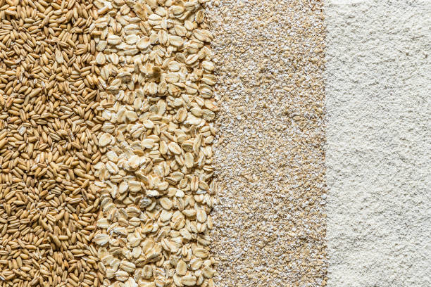 Oat flakes on a background of rough burlap. A diet rich in vitamins and nutrients.