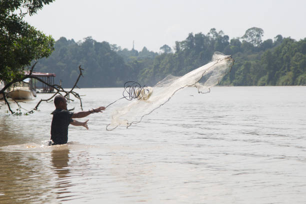 istock Native fisherman with rai 1126713550