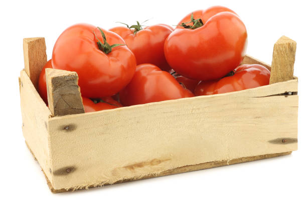 istock fresh beef tomatoes in a wooden crate 1126714730