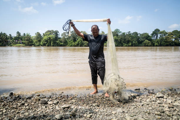 istock Native fisherman with rai 1126717292