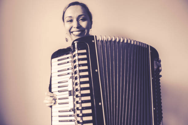 istock Young Woman with old Accordion 1126718295