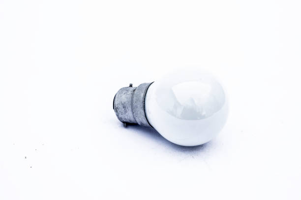 istock Close up of white colored bulb isolated on white. 1126720442