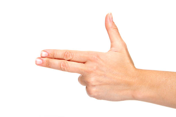 Woman hand showing forefinger in gun sign