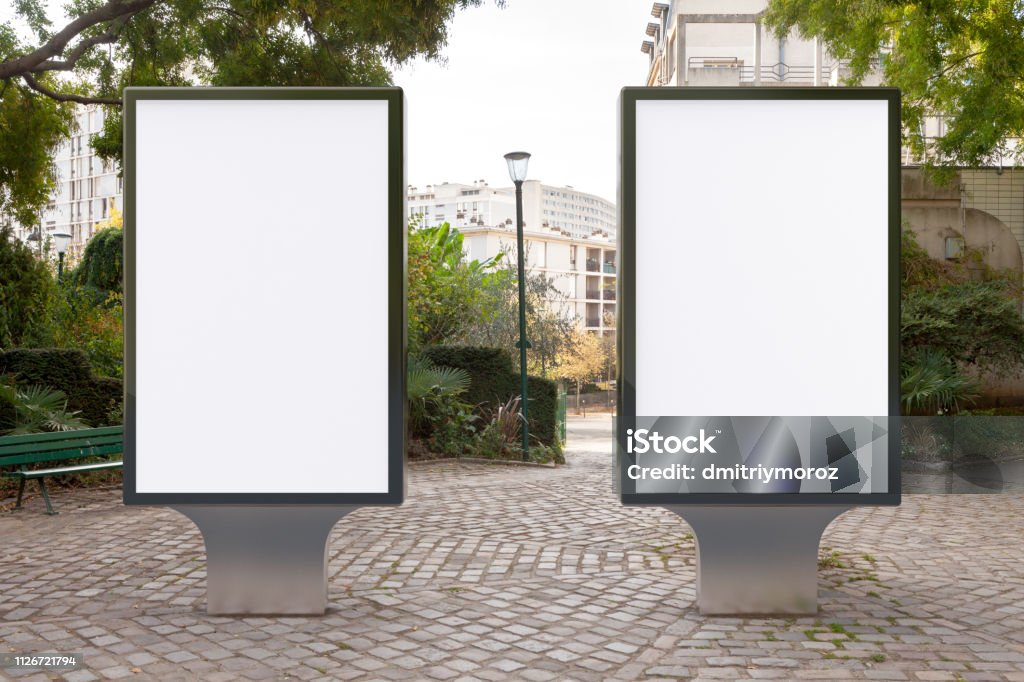 Blank street billboard poster stand Blank street billboard poster stand in the park. 3d illustration. Billboard Stock Photo