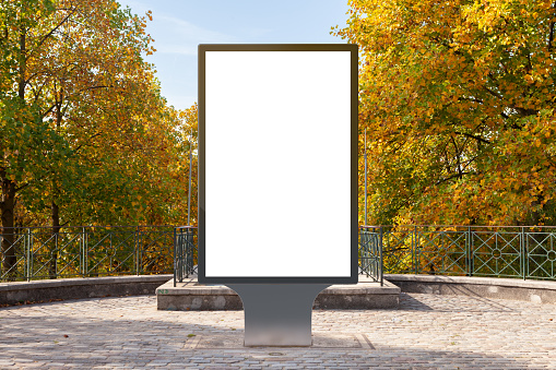 Blank street billboard poster stand in the park. 3d illustration.