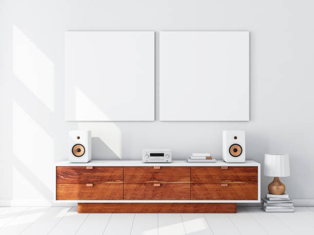 istock Two square white canvas Mockups hanging on the wall, hi fi micro system on bureau 1126725293