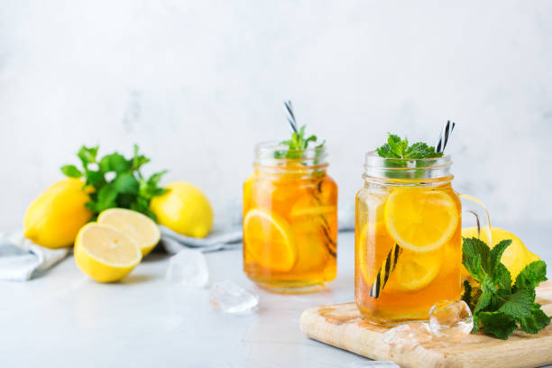 istock Lemon mint iced tea cocktail refreshing drink for summer days 1126725952