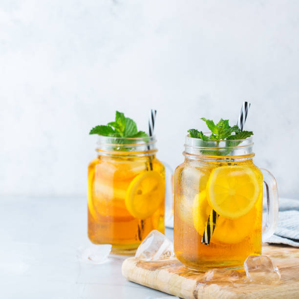 istock Lemon mint iced tea cocktail refreshing drink for summer days 1126726074