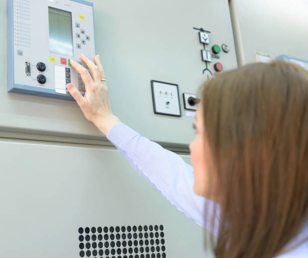istock Young female worker working in electric power station 1126727506