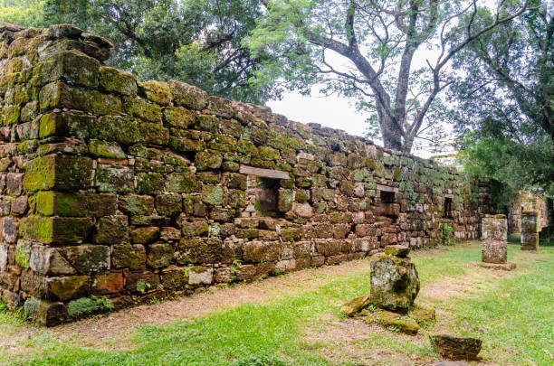istock Old constructions covered with moss and full of windows and a corridor on the front in San Ignacio ruins, Misiones, Argentina 1126727676