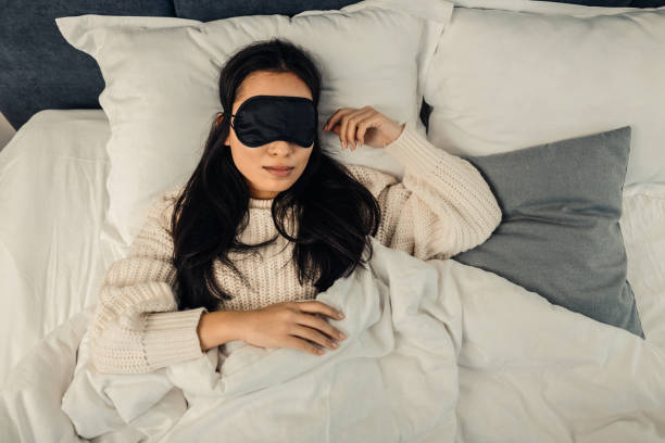 istock Dark-haired woman feeling relieved and relaxed while sleeping 1126729435