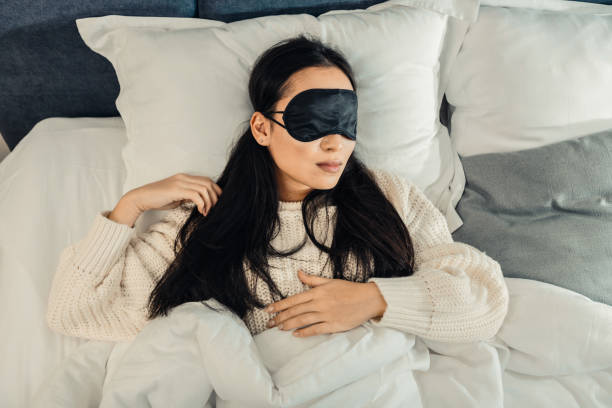 istock Tired businesswoman feeling relieved sleeping in her bed 1126729442