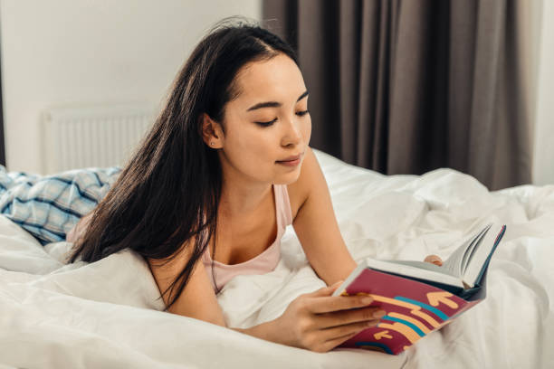 istock Businesswoman looking at notebook and checking working schedule 1126729482