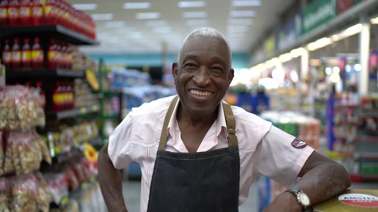 Senior Man Business Owner / Employee at Supermarket