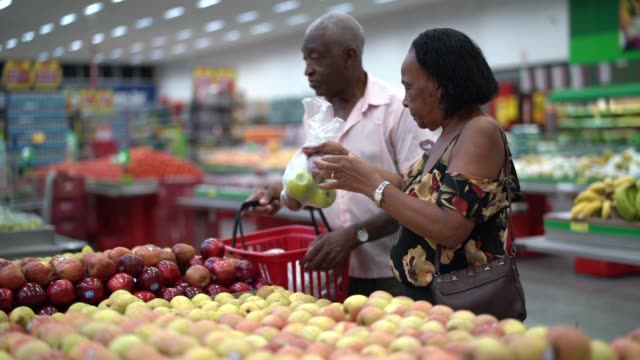 Senior Couple Buying on Supermarket