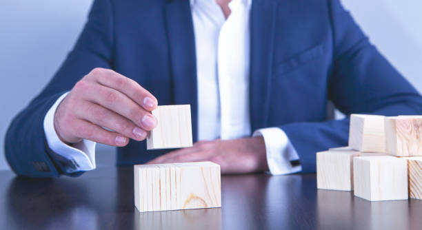 istock businessman wooden cube 1126732563