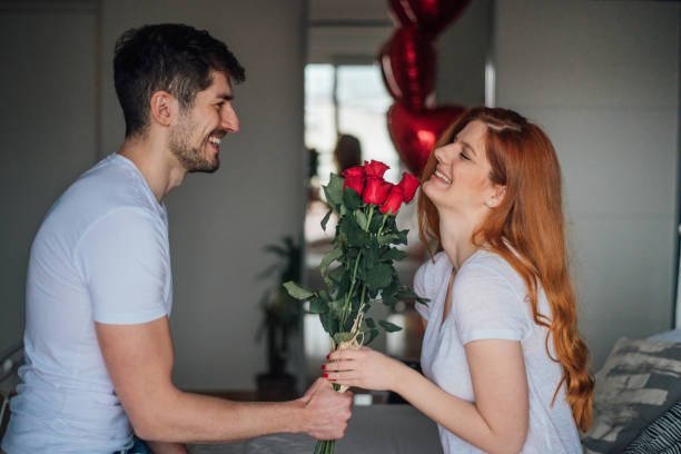 istock Woman receiving roses 1126732996