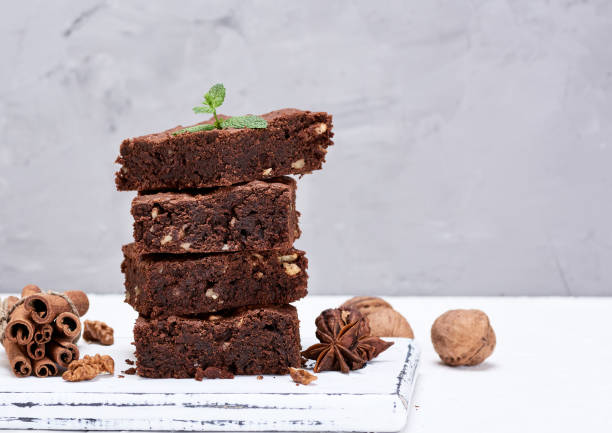istock baked square pieces of chocolate brownies with walnuts 1126733083