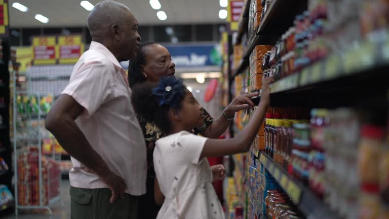 Afro Hispanic Latino family buying on supermarket