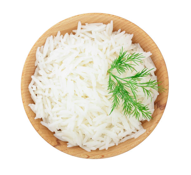 istock rice in a wooden bowl isolated on white background. Top view. Flat lay 1126733253