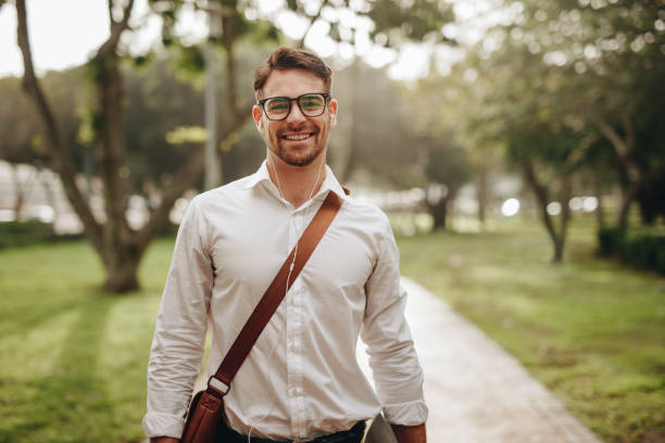 istock Smiling businessman walking to office 1126734915
