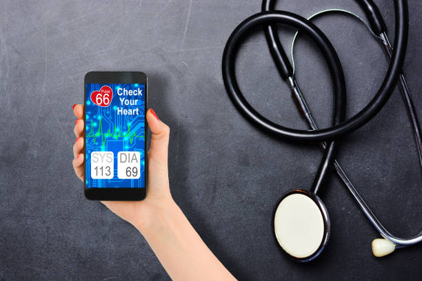 istock Blood pressure checking or tracking with smartphone and stethoscope on blackboard 1126736416