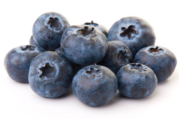 istock Fresh blueberries close up on the white background 1126742498