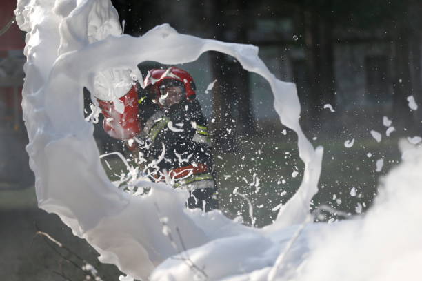 istock Extinguishing forest fire.Extinguishing the fire. Firemen are working. Fill the foam with a fire. Resolute firefighters. Fight fire. 1126744544