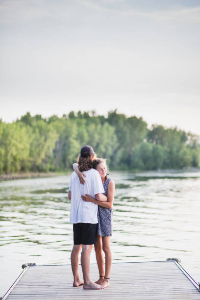 istock Young heterosexual  couple on a pier 1126748810