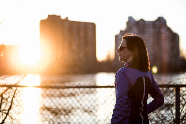 istock Woman at sunset 1126749198