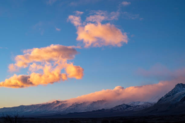 istock cloudy morning sky above snowy mountain peaks 1126749883