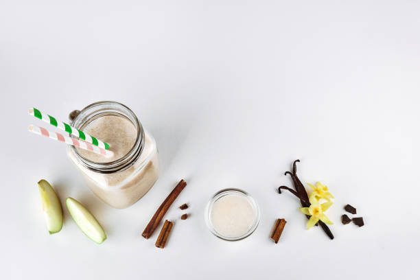 Cocktail, protein with apple, cinnamon, vanilla in a glass jar. Functional nutrition