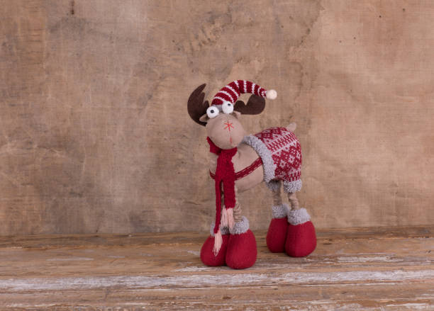 istock Christmas toy funny deer on a wooden background 1126761279