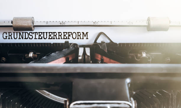 istock German word Grundsteuerreform (property or land tax reform) written on old typewriter 1126767967