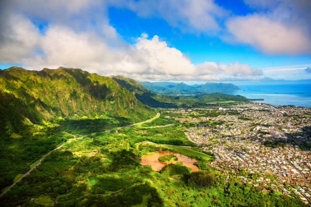 Suburban Oahu Aerial Landscape The town of Kaneohe on the eastern shore of the island of Oahu, Hawaii located about thirty miles from Honolulu shot from an altitude of about 1000 feet. oahu stock pictures, royalty-free photos & images