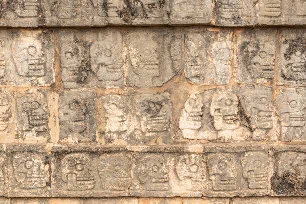istock Row of skulls from the sacrificed people in Chichen Itza 1126773123