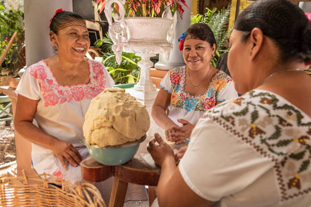 Women making Tortillas Group of smiling cooks preparing flat bread tortillas in Yucatan, Mexico mayan stock pictures, royalty-free photos & images