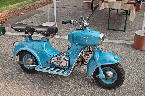 Italian scooter Rumi Formichino 125 twin-cylinder engine of the fifties in Classic car and motorcycle rally \