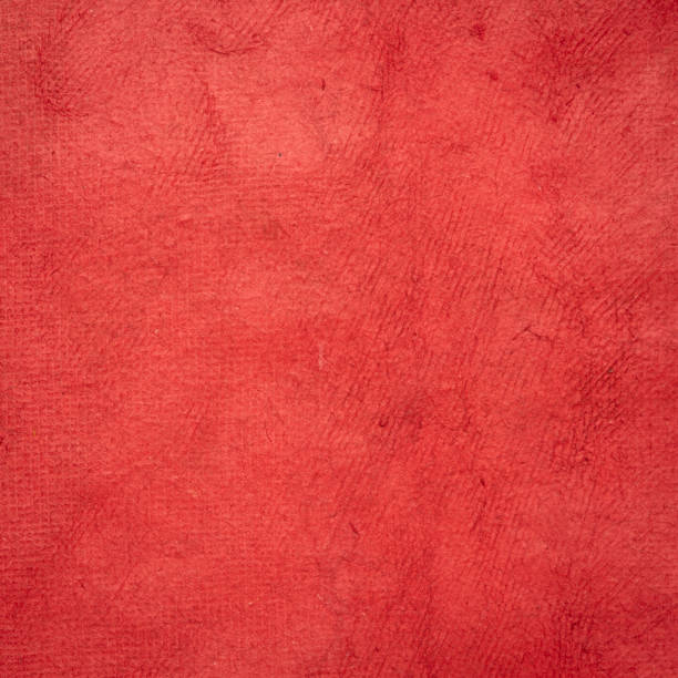 istock red Huun Mayan paper background 1126779859