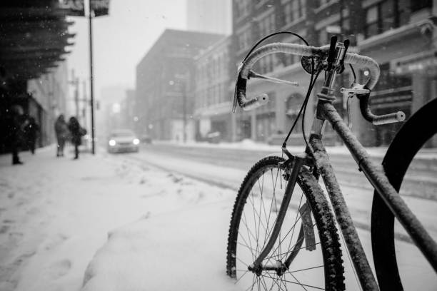 Bicycle parked on snow at yonge street in toronto