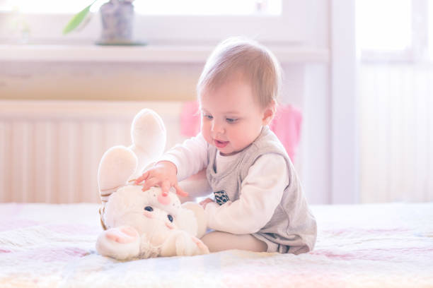 istock Baby playing with a plush toy 1126791194
