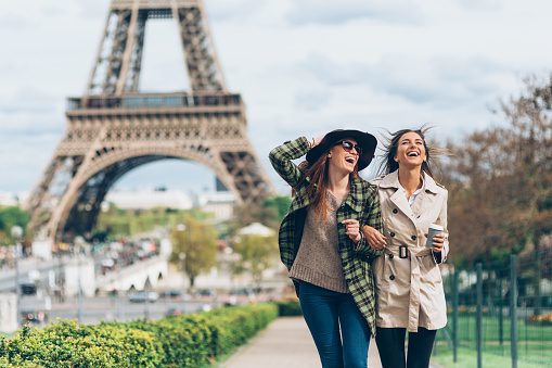 Two girlfriends enjoying walk in Paris