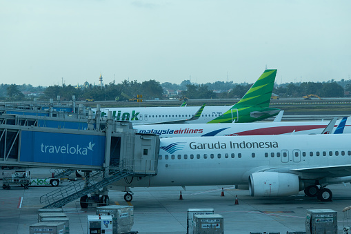 Jakarta, Indonesia - January 7, 2019: Aircrafts of Garuda Indonesia, Citilink, and Malaysia Airlines at Soekarno Hatta International Airport Terminal 3