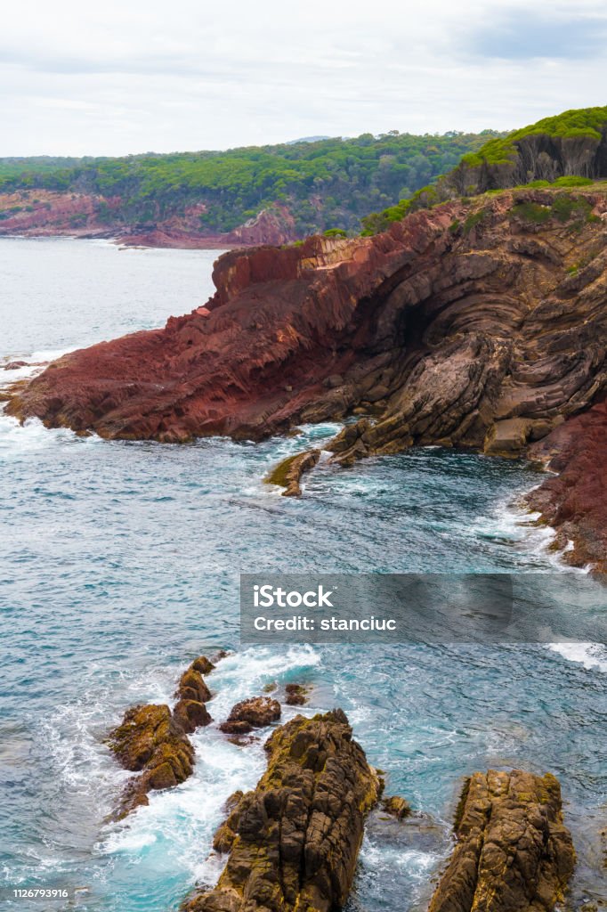 Marine red folded rocks in Ben Boyd National Park, NSW, Australia Australia Stock Photo