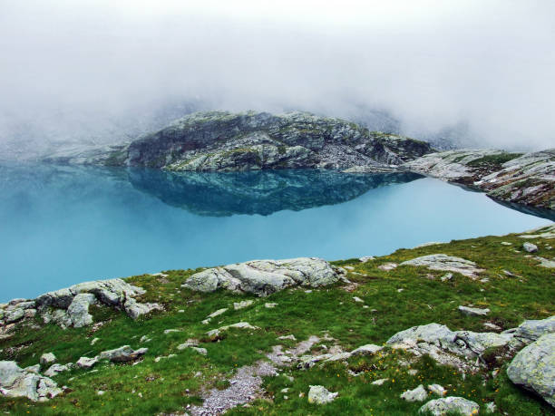 Alpine Lake Schottensee under the Pizol peak in the mountain range Glarus Alps - Canton of St. Gallen, Switzerland
